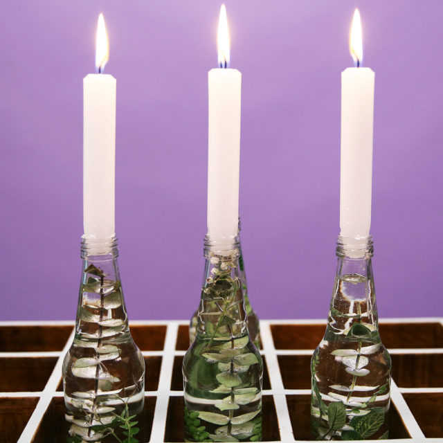 bottled upcycle DIY with lit candle