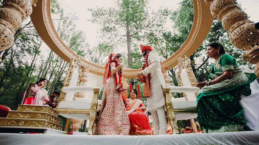 Hindu bride and groom complete wedding rituals outside