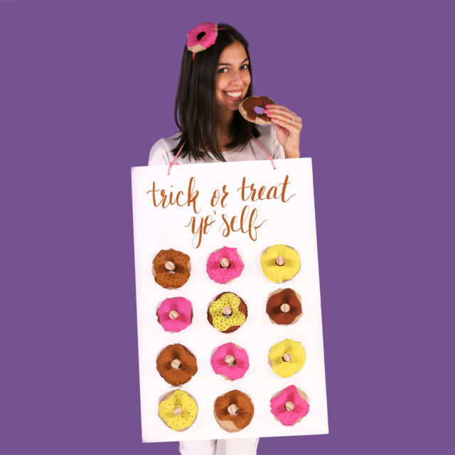 girl wearing donut wall costume